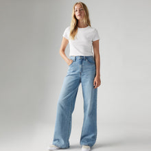 Load image into Gallery viewer, Levi's Cinch Baggy Jeans in Invested Indigo, styled on model