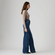 Load image into Gallery viewer, Levi's Ribcage Wide Leg Jeans in Maybe Anywhere wash, side view on model