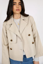 Load image into Gallery viewer, Marlow Unity Short Trench - Oat Apparel > Women > Clothing > Jackets > Trench Coats > Cropped Trench Coats > Marlow Hyde Boutique
