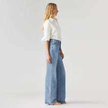 Load image into Gallery viewer, Levi's Ribcage Wide Leg Jeans in Not The Same wash, side view on model
